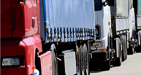 A truck with its door open on the road.