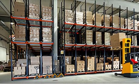 A warehouse filled with lots of boxes and racks.